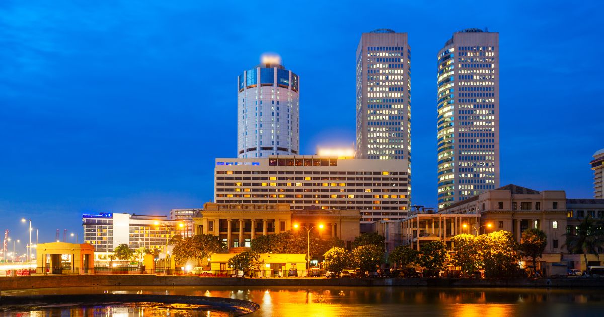 Night time photo of Sri Lanka's old parliament, Bank of Ceylon, and WTC buildings | CBSL looking into digital currency article