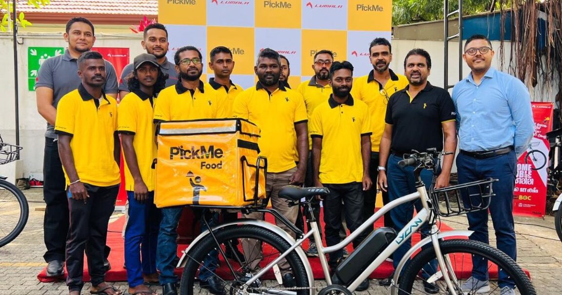PickMe team posing with the Lumala team after partnership announcement