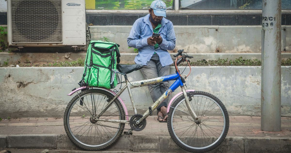 Uber Eats Sri Lanka delivery partner on his phone