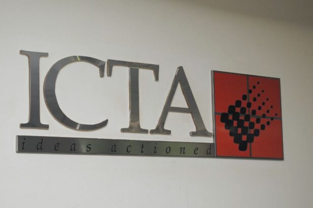 Image of the ICTA logo on a white wall with the tagline "ideas actioned"