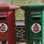 Two mailboxes belonging to Sri Lanka Post, one red and other green