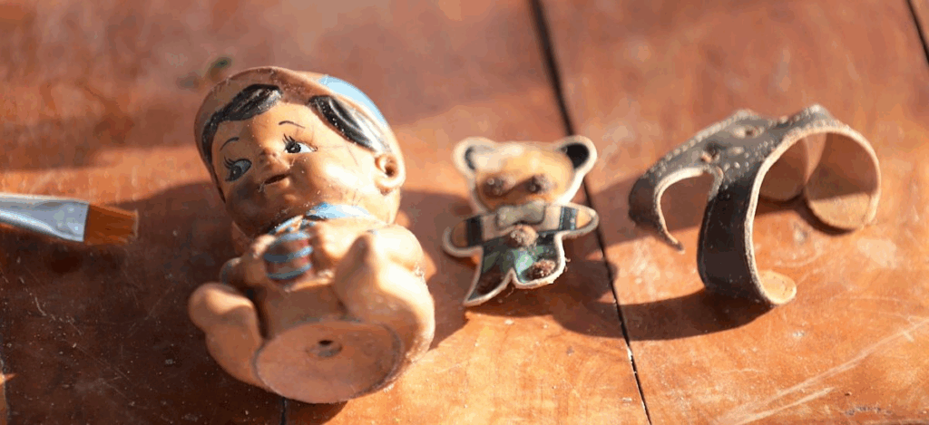 Picture of children's toys that were found during the Chemmani mass grave excavation